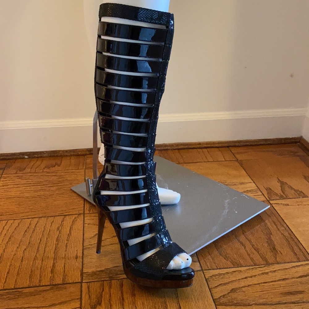 Sexy patent leather banded knee high boots.